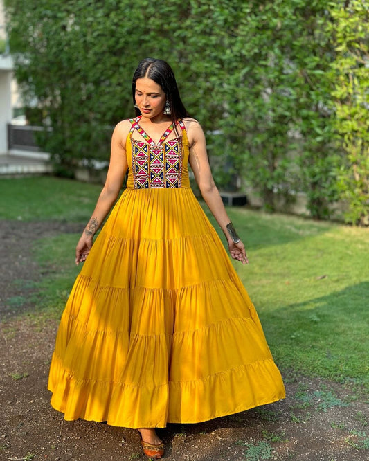 Krishna Patel In Mustard Yellow Color Full Flairy Rayon Navratri Backless Gown